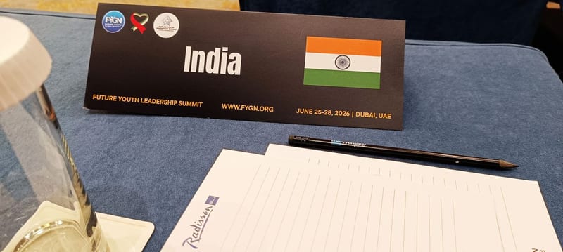 A delegate place card reading India on the table at the Future Youth Leadership Summit.